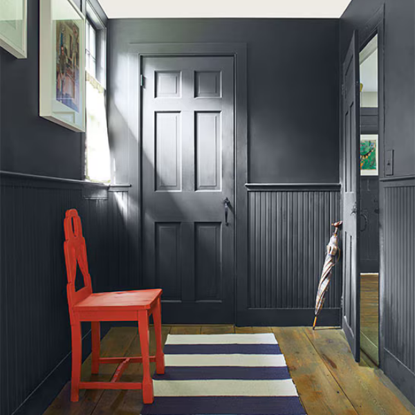 A bold, dark hallway painted using Benjamin Moore's Color Preview Collection