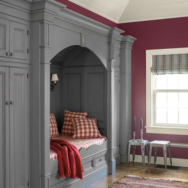 A classy, traditional bedroom painted in Benjamin Moore Williamsburg Collection colors on the walls, trim, and architectural details